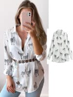 Blouse en satin blanc à manches longues avec motif zèbre